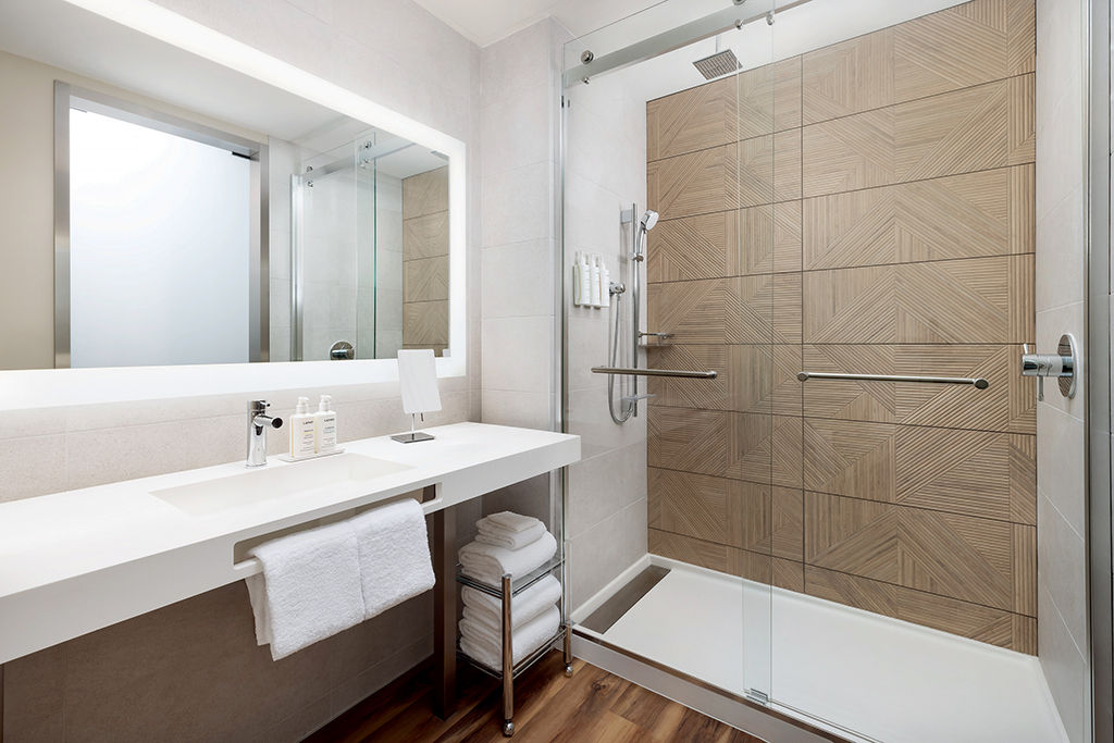 The AC Hotel’s room bathrooms complement the hotel’s modern stylings.