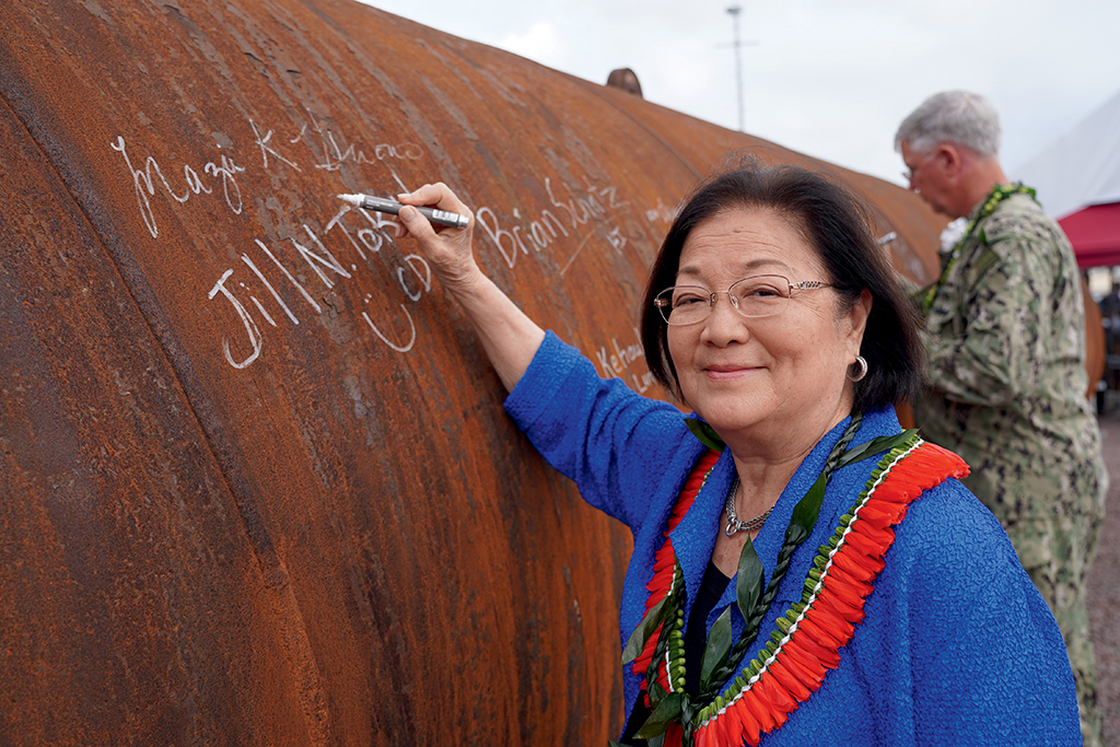U.S. Sen. Mazie Hirono signs a wide-diameter steel piling during a Navy installation ceremony in February. 
PHOTO COURTESY U.S. NAVY/JUSTICE VANNATTA