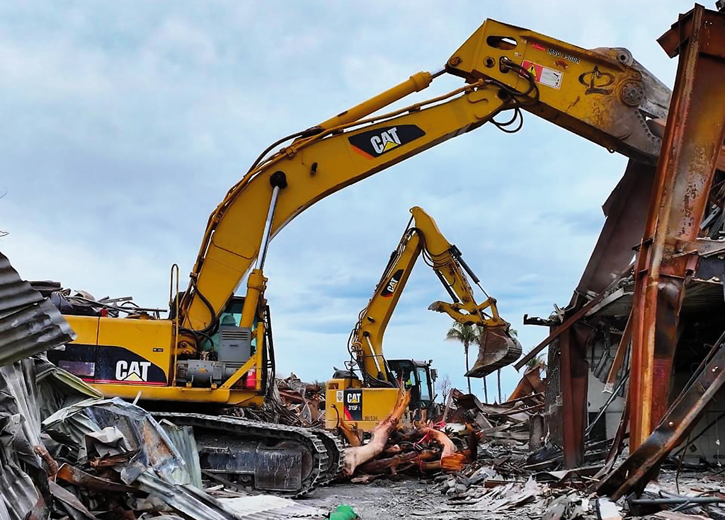 Two Cat 306 hydraulic excavators clear debris in La-haina- in 2023.

 PHOTO COURTESY HAWTHORNE CAT