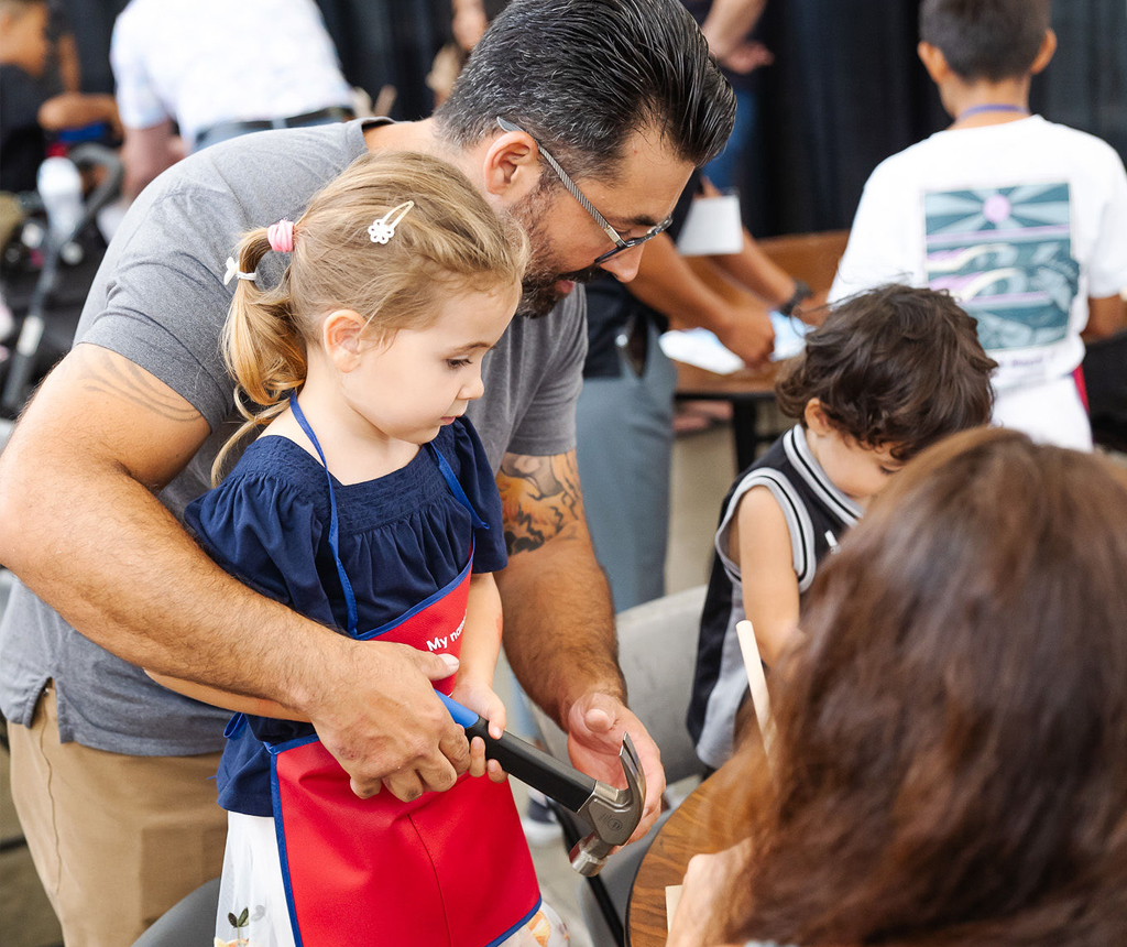 A BIA member and family explore the BIA Home Show Keiki Zone.